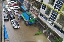 ပုံစာ - ရန်ကုန်တွင် မိုးရွာသွန်းပြီးနောက် ရေကြီးရေလျှံမှု ဖြစ်ပေါ်နေသည့် မြင်ကွင်း။ (ပုံအဟောင်း)